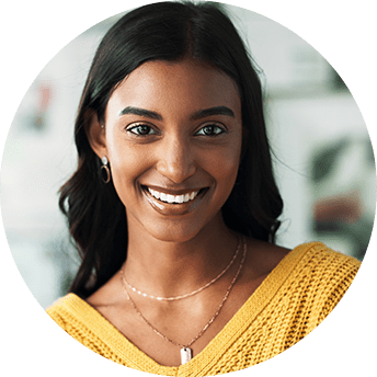 Smiling woman in a yellow sweater.